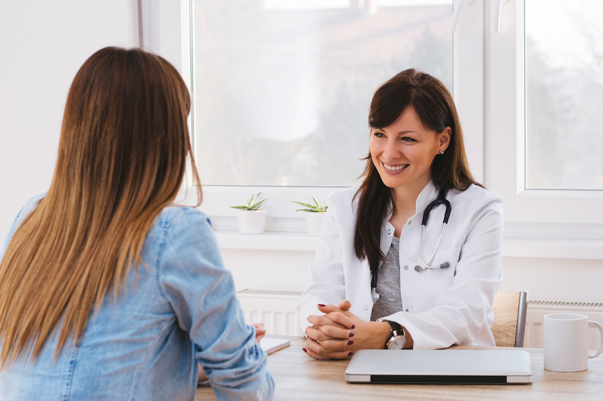 woman talking to doctor